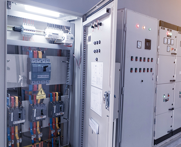 Open electrical switchboard with circuit breakers.