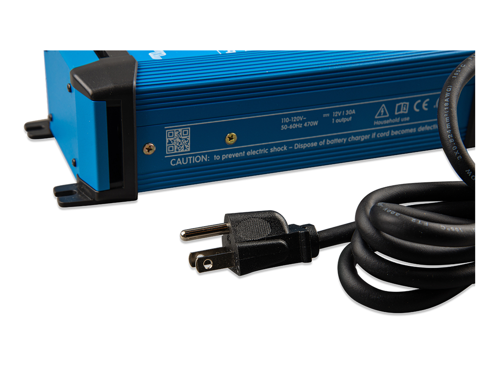 Close-up of the Victron Blue Smart IP22 Charger 12V 30A rating label and US NEMA 5-15 plug.