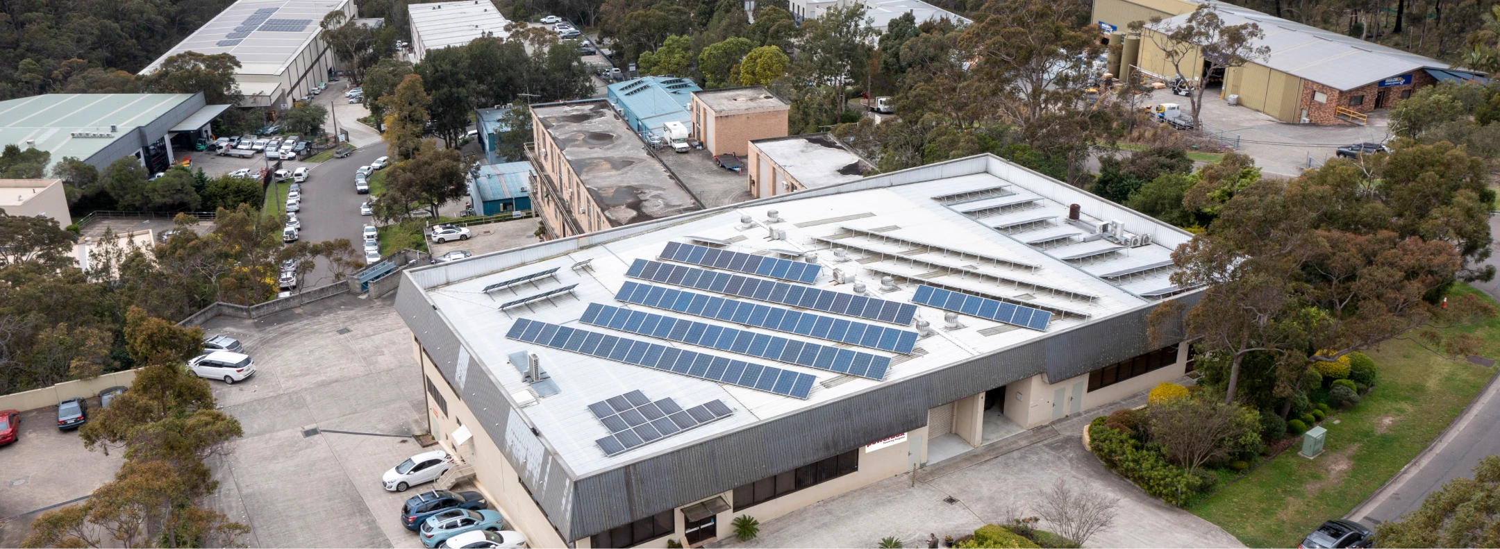 Factory building with solar panels on the roof.