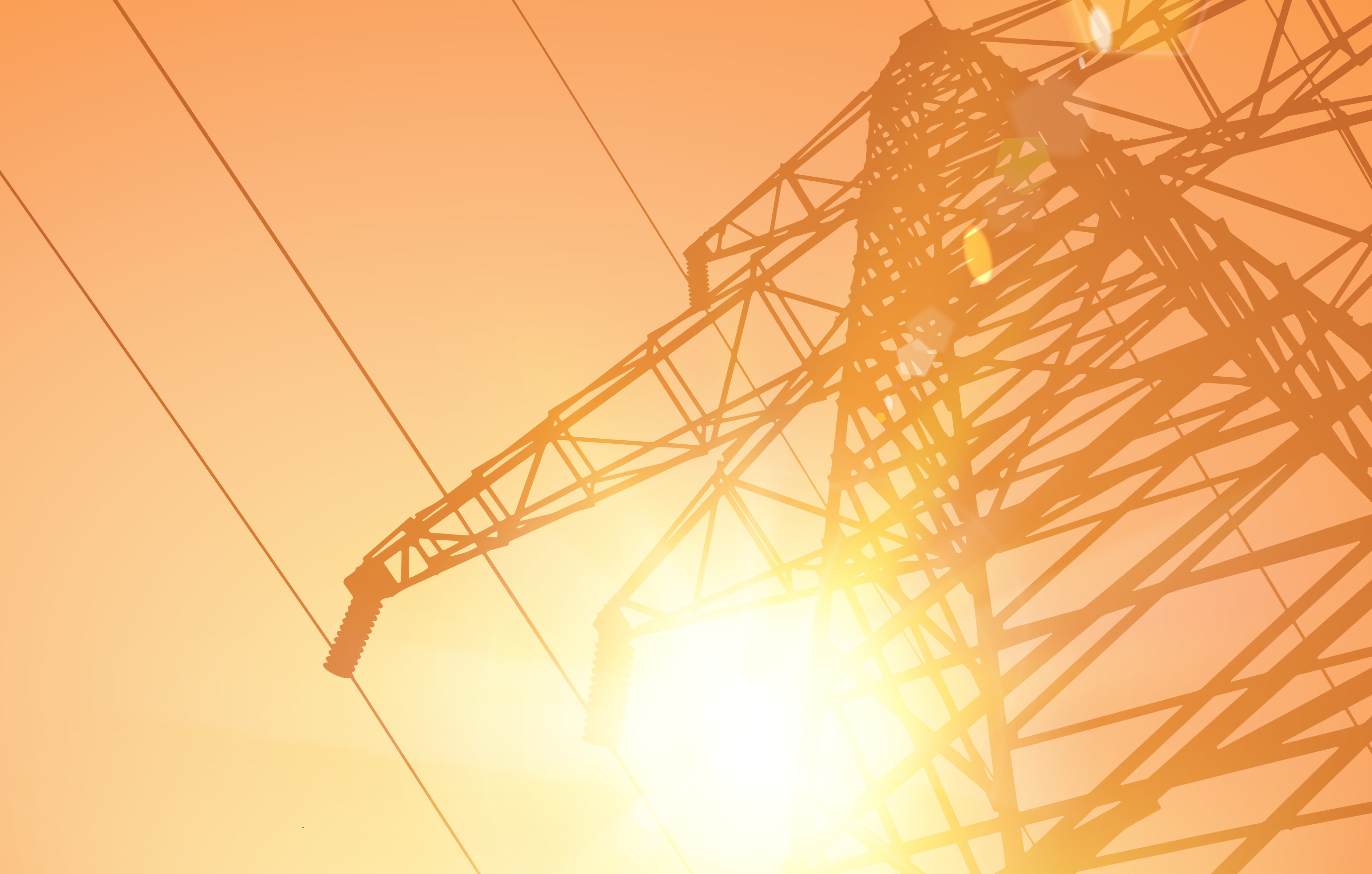 Powerline tower silhouetted against an orange sky.