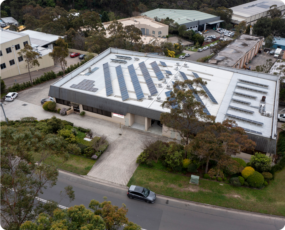 Factory building with solar panels on the roof.