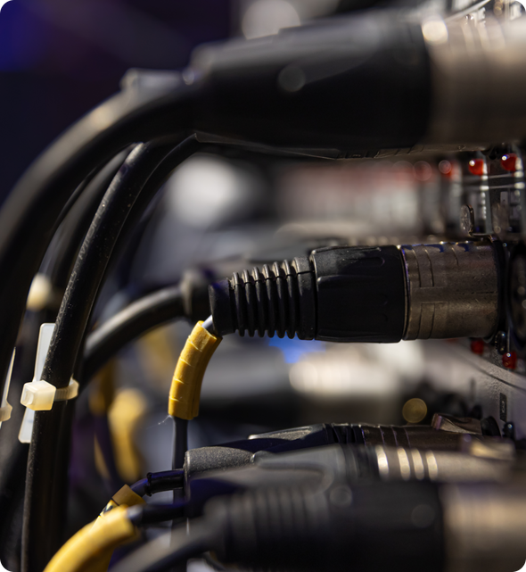 Close-up of industrial power cables connected to electronic equipment
