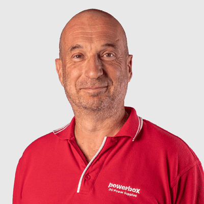 Man in red Powerbox polo shirt, specialist in power conversion and energy storage solutions